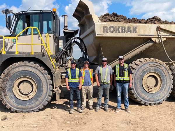 Rokbak Haulers Worth Their Weight In Gravel For Alberta Crew.  Scott Ritchie, foreman for Boden Sand & Gravel, Ryan Skjonsberg, operator for Boden S&G, Brad Boden, supervisor for Boden S&G and Scott Letkeman, Headwater Equipment salesman.