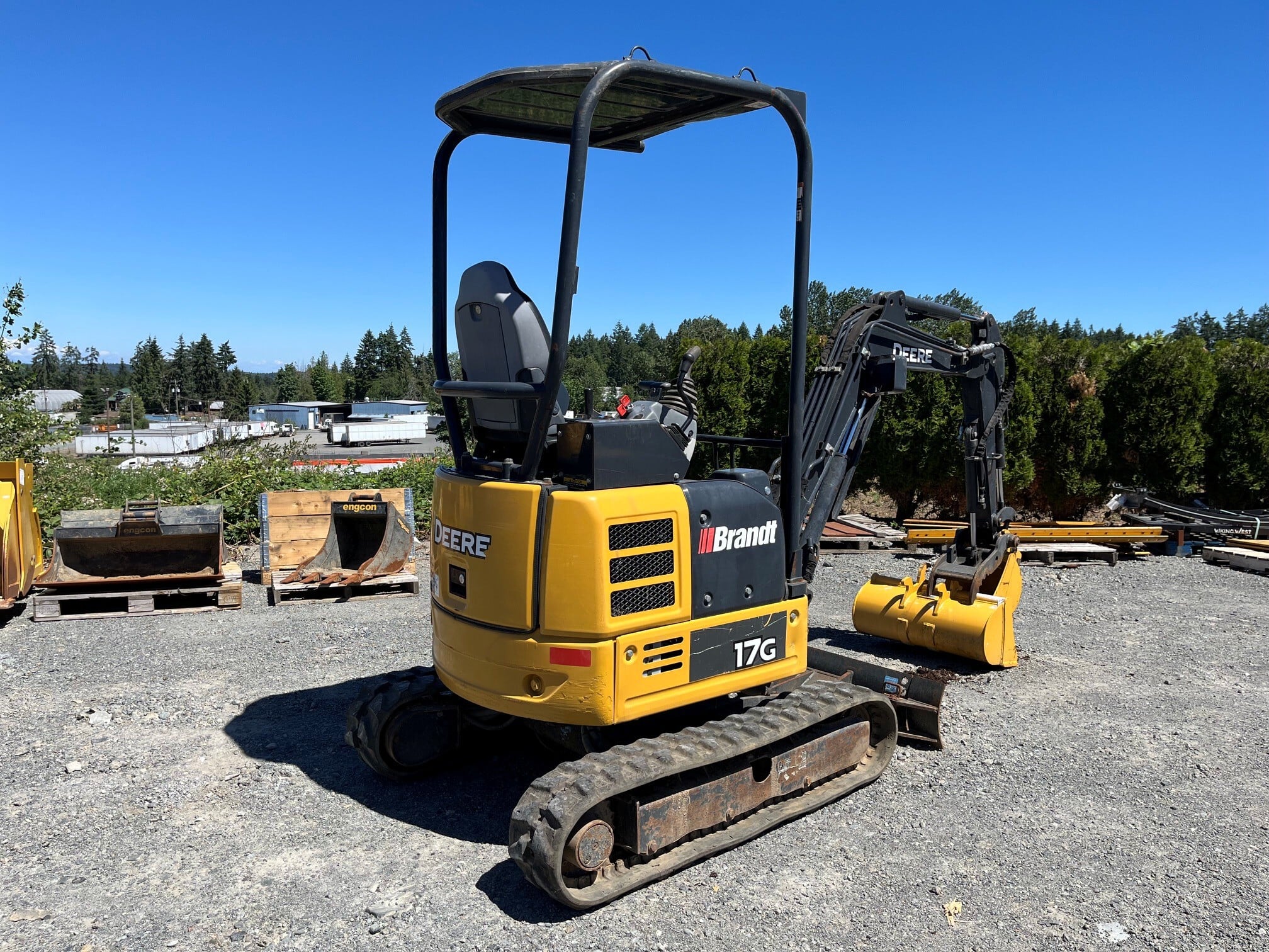 A John Deere mini excavator on the job — models like the 17G and 35G are popular choices across Canada.
