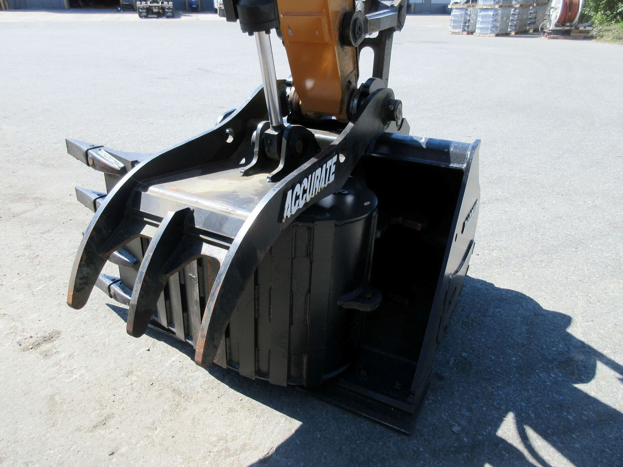 Hydraulic thumb attachment on a mini excavator