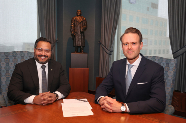 Winnipeg To Be Future Home of Gate. Dean Dias and Thor Richardson in a boardroom with the MOU for the Future Home of Gate.