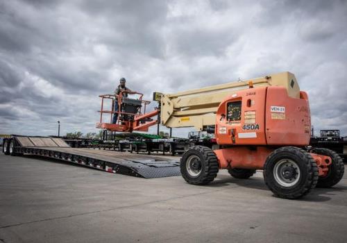 When it comes to selecting a trailer to haul your heavy construction equipment, you have more than a few options to consider. And when your trailers are carrying a variety of machines to and from the jobsite it only gets more complex. To make the process less daunting, we asked the experts from three trailer manufacturers to discuss the most important considerations.  Find The Right Size Trailer Matching the capacity of the trailer to the weight of the equipment you want to haul is key. “Buying too small is unsafe, buying too much capacity is a waste of money,” says Jim Ladner, national sales manager for Landoll Company, Transportation Products division. “A good decision now is a great ROI on the selling side.” But it’s not just the trailer you need to consider. “It’s imperative that both the trailer and the tow vehicle are appropriately sized to carry the load,” says Nathan Uphus, sales manager, Felling Trailers. Also don’t forget to consider the weight of attachments you plan to haul along with the machine. Uphus says attachments are often overlooked. “Most excavators have a travel mode that narrows the width of the machine,” says Troy Geisler, vice president of sales and marketing for Talbert Trailers. “However, some operators will not go to the trouble that it takes to put the machine in travel mode. You have to know how your operators will actually load the machine or you could stress the trailer.”    Geisler cautions that buyers need to beware when comparing load capacity. “There is no standard method to determine a capacity rating, “says Geisler. “Some manufacturer ratings may be based on an impractical load distribution.” A 35- to 65-ton capacity trailer is needed to carry most mid-size or large construction equipment. A 55- to 65-ton capacity trailer is typically needed for transporting larger cranes and specialty equipment.  Know Where Are You Going To Haul Your Equipment Regulations change from state to state so it’s important to consider where you want to travel. “You want to make sure you have the right trailer capacity, the correct number of axles and the axles are positioned in the correct locations,” says Ladner.  Can One Trailer Do It All? “It’s common for users to want to buy a single trailer that hauls all their equipment, but in most cases that’s not possible, says Ladner. ““Users should consider selecting a trailer that accomplishes 80 percent of their moves and sub-contract the highly specialized loads to an outside hauler.” Ladner says the more pieces of equipment you can transport in a single move the more you will reduce hauling costs. He advises operators to look for more useable deck space to accommodate a wide variety of equipment.  Trailer Types 101 Different trailer designs offer varying benefits for transporting heavy construction equipment.  Lowboy, low bed trailers or float trailers (Eastern Canada) feature two drops in deck height: one right after the gooseneck and one prior to the wheels. It’s designed to keep the heavy haul load as low as possible – 18 inches off the ground.  If you are worried about maximizing vertical clearance to safely transport equipment, this can be a good option. “The lower the better” really plays true to help reduce the chances of rollovers accidents,” says Ladner. Gooseneck trailers have a 'neck' that extends over the box or bed of the tow vehicle. A ball hitch is placed into the box of the truck.” The design offers greater stability because weight is centered on the rear axle of the truck rather than the rear bumper. A drop deck trailer, is an open trailer with two deck levels: an upper deck and a lower deck that drops down after clearing the tractor unit.  Equipment is typically loaded using fold down ramps. According to Geisler, these types of trailers are useful for hauling compact construction equipment. With tilt trailers there is no need for a ramp to load and unload equipment. However, some equipment, such as pavers require a very shallow load angle, so ramps are sometimes added.  The axles are further forward on the tilt trailer compared to a beavertail trailer (with ramps). This allows the trailer to tilt without hitting the tires and also improves maneuverability. Hydraulic tilt models generally have a stationary platform ahead of the tilt deck. The stationary platform remains flat while the tilt deck allows the machine to be loaded/unloaded.   On sliding or traveling axle trailers the axle travels forward, allowing the tail of the trailer to lower to the ground. This creates a “ramp” to load equipment on and delivers a load angle of six degrees. Don Landoll, owner and chairman of Landoll Company, invented and patented the Traveling Axle trailer in 1969.  b